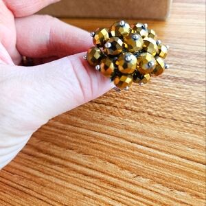 Gold colored bauble ring with adjustable band